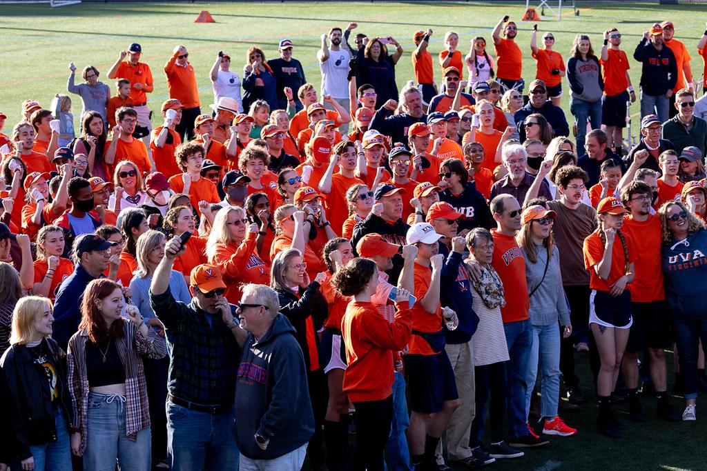 Families of CMB members join their students on Carr's Hill field to sing "The Good Old Song" after the October 23 game day rehearsal. (Photo Credit: Tom Pajewski)