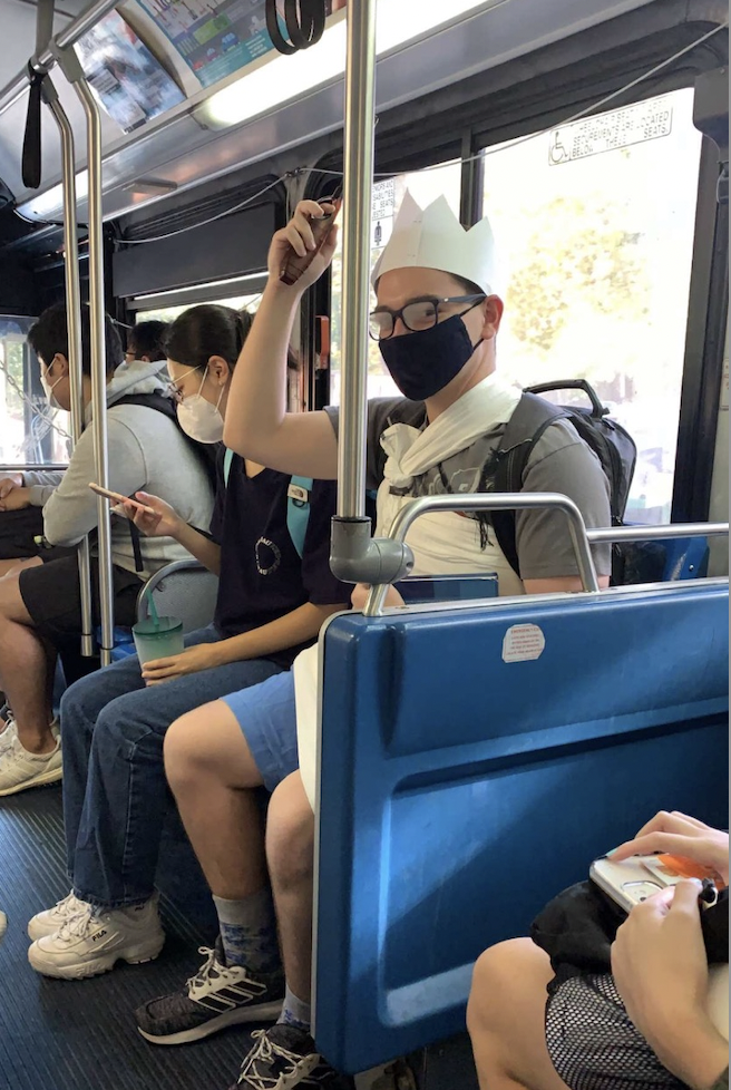 Christian Riewerts takes the UTS bus to class while wearing his Sock Wars immunity for the day. (Photo courtesy of student)o courtesy of student)